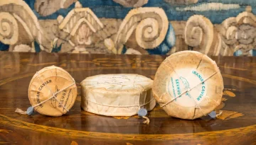 “Three vintage cans of traditional Iranian caviar, sealed and packaged in classic style, showcasing historic packaging methods.” “Old-fashioned cans of Iranian caviar, displaying traditional sealing and packaging techniques used in historical Iran.” “Set of three antique caviar cans from Iran, featuring traditional packaging and sealing methods.”