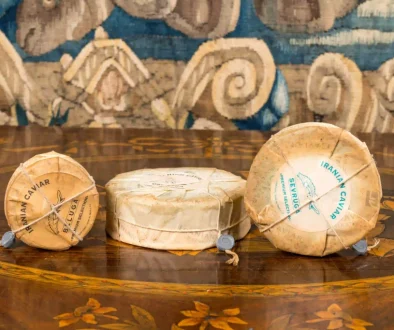 “Three vintage cans of traditional Iranian caviar, sealed and packaged in classic style, showcasing historic packaging methods.” “Old-fashioned cans of Iranian caviar, displaying traditional sealing and packaging techniques used in historical Iran.” “Set of three antique caviar cans from Iran, featuring traditional packaging and sealing methods.”